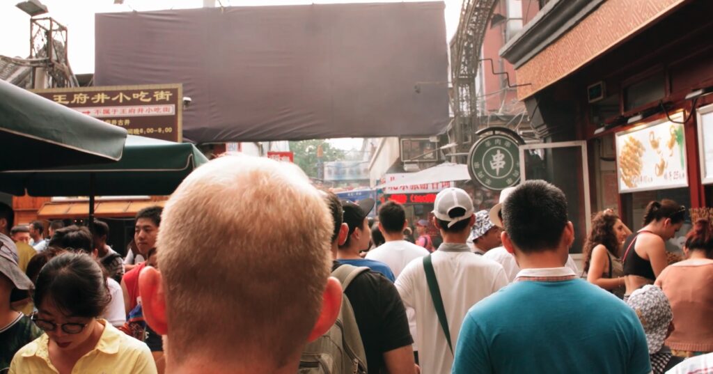 people walking in a bazaar